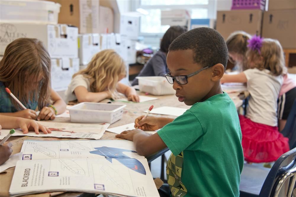  children at  desks 